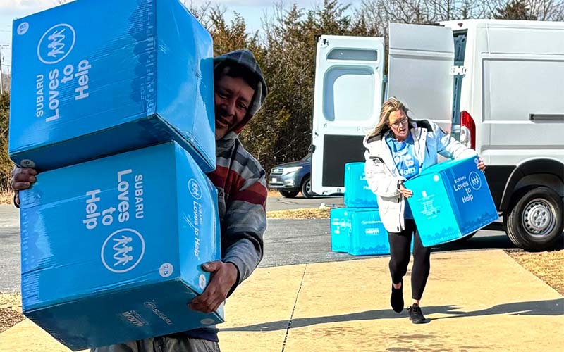 Employees carrying boxes