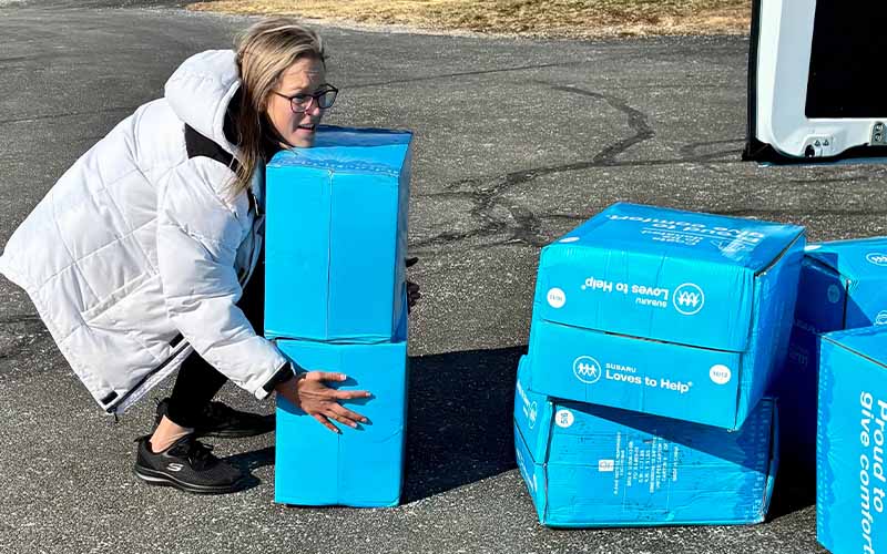 Woman carrying boxes