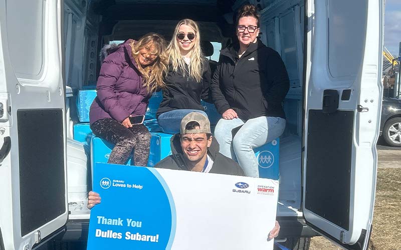 People sitting in the back of a van