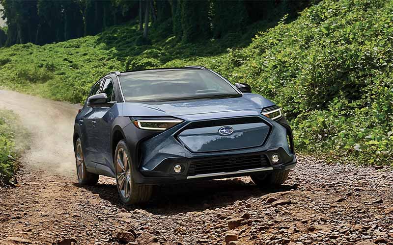 2024 Subaru Solterra driving on rough dirt road